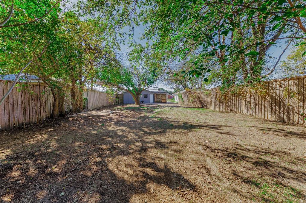 3305 Elm Grove Road Rowlett, TX 75098 - Photo 23 of 24 Fenced backyard featuring an outdoor structure