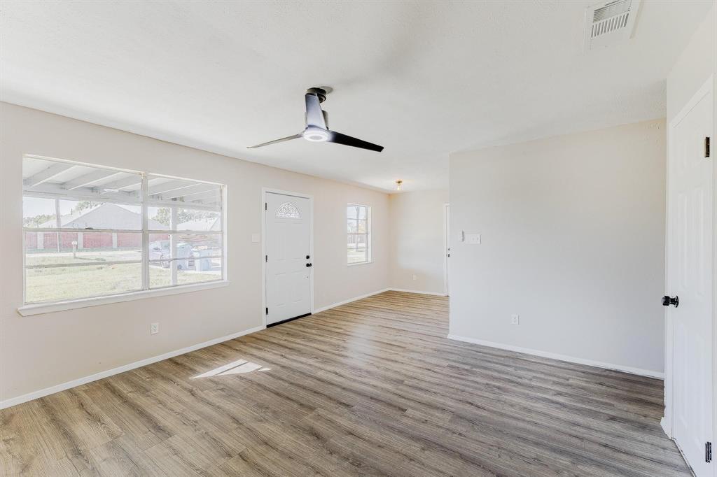 3305 Elm Grove Road Rowlett, TX 75098 - Photo 3 of 24 Foyer entrance featuring light wood finished floors and a ceiling fan
