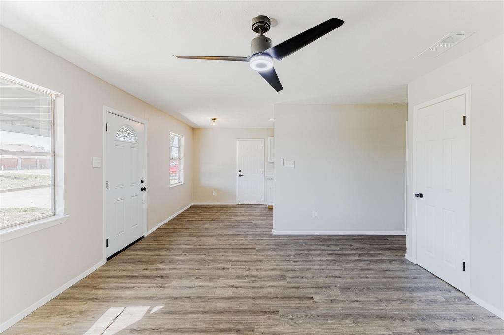 3305 Elm Grove Road Rowlett, TX 75098 - Photo 5 of 24 Entrance foyer featuring light wood-style floors and a ceiling fan