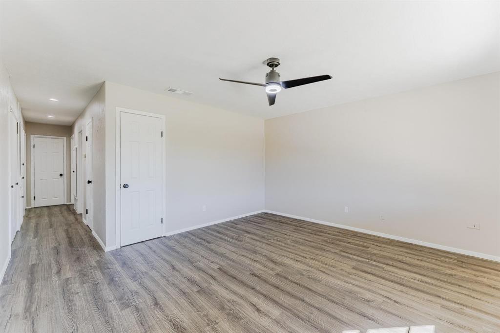 3305 Elm Grove Road Rowlett, TX 75098 - Photo 6 of 24 Spare room with light wood-style floors, ceiling fan, and recessed lighting