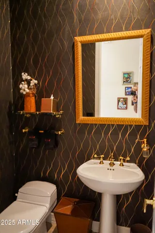 a bathroom with a sink and a toilet