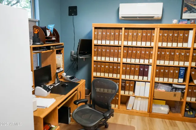 a table chair sitting in a kitchen next to a window