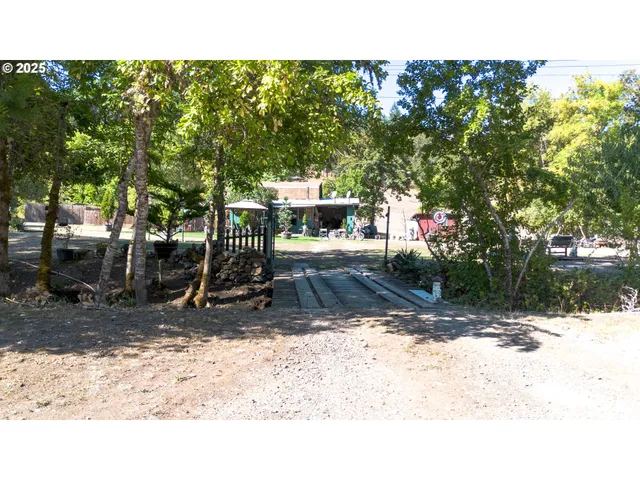 a backyard of a house with barbeque oven