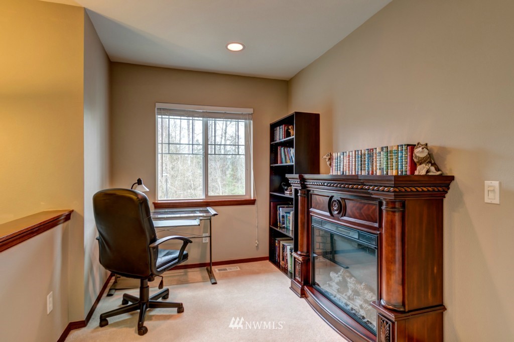 21228 11th Drive Southeast Bothell, WA 98021 - Photo 14 of 23 a work room with furniture and a window