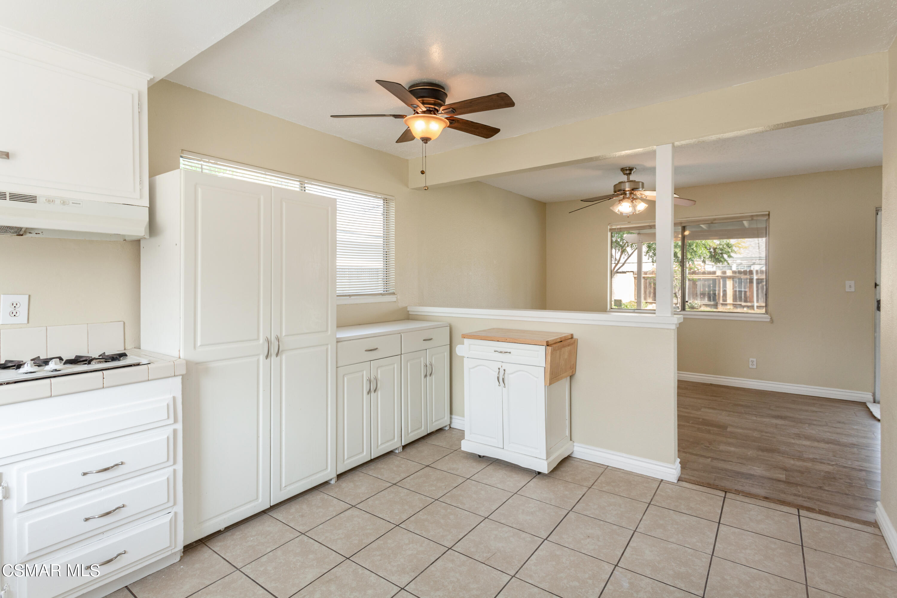 2291 Lysander Avenue Simi Valley, CA 93065 - Photo 11 of 25 a view of a kitchen with cabinet and a fireplace