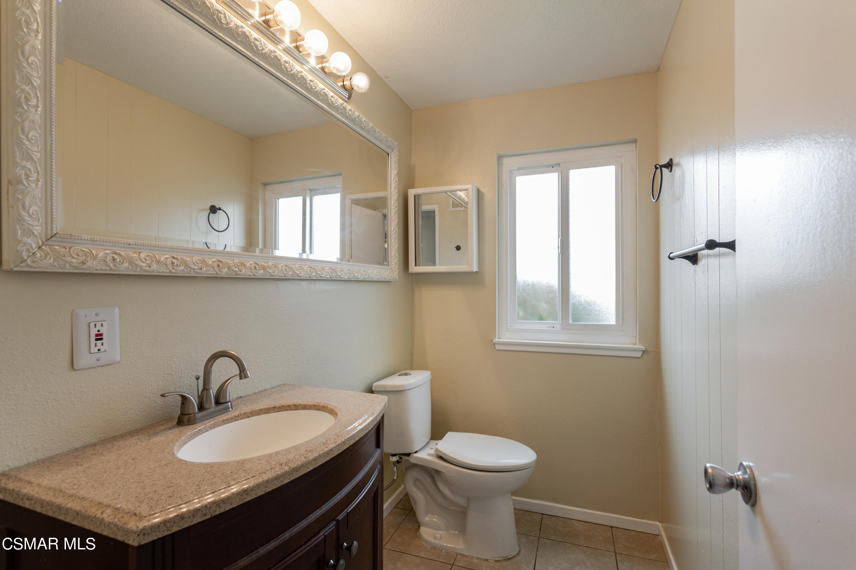 2291 Lysander Avenue Simi Valley, CA 93065 - Photo 12 of 25 a bathroom with a sink and a toilet