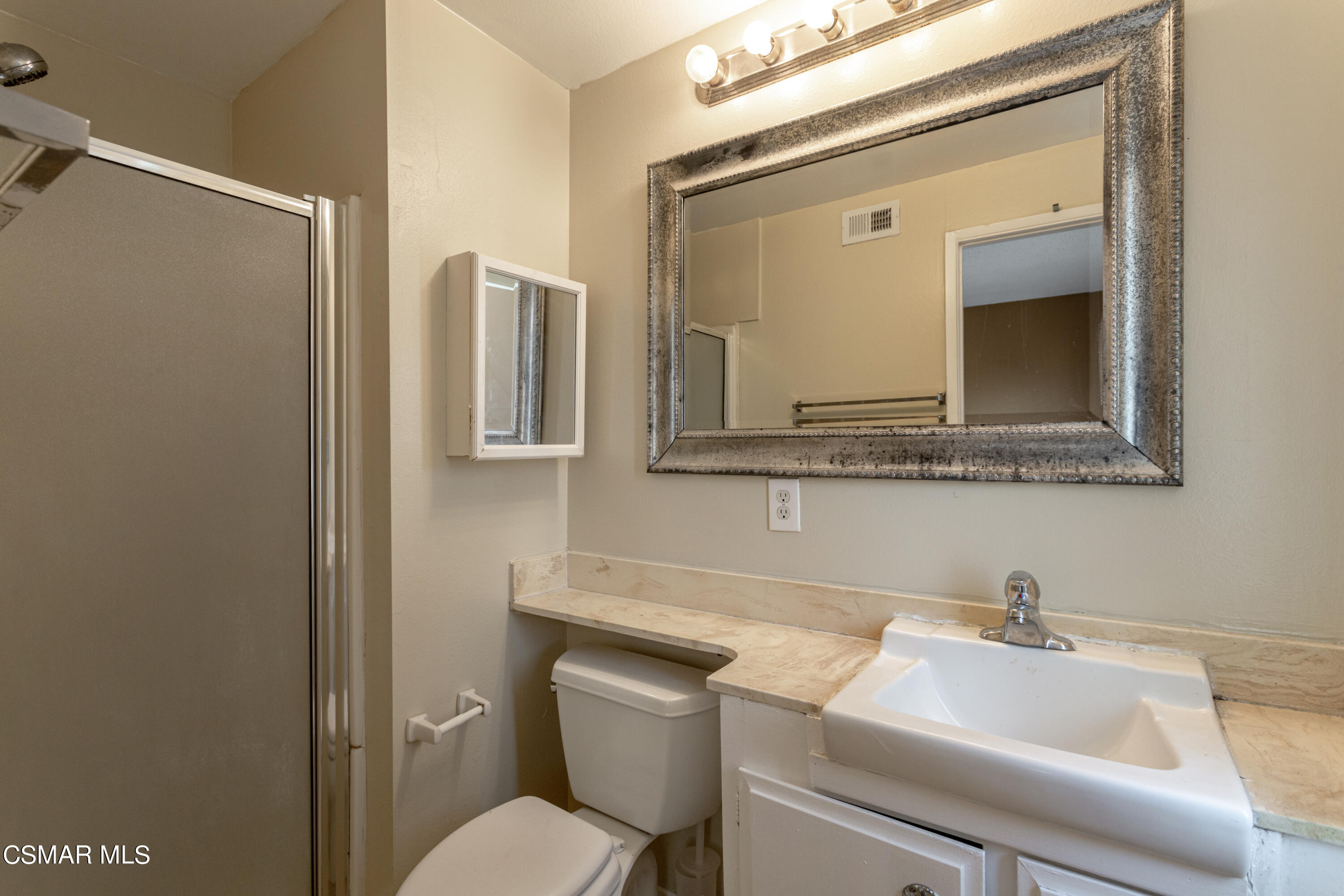 2291 Lysander Avenue Simi Valley, CA 93065 - Photo 15 of 25 a bathroom with a toilet sink and mirror
