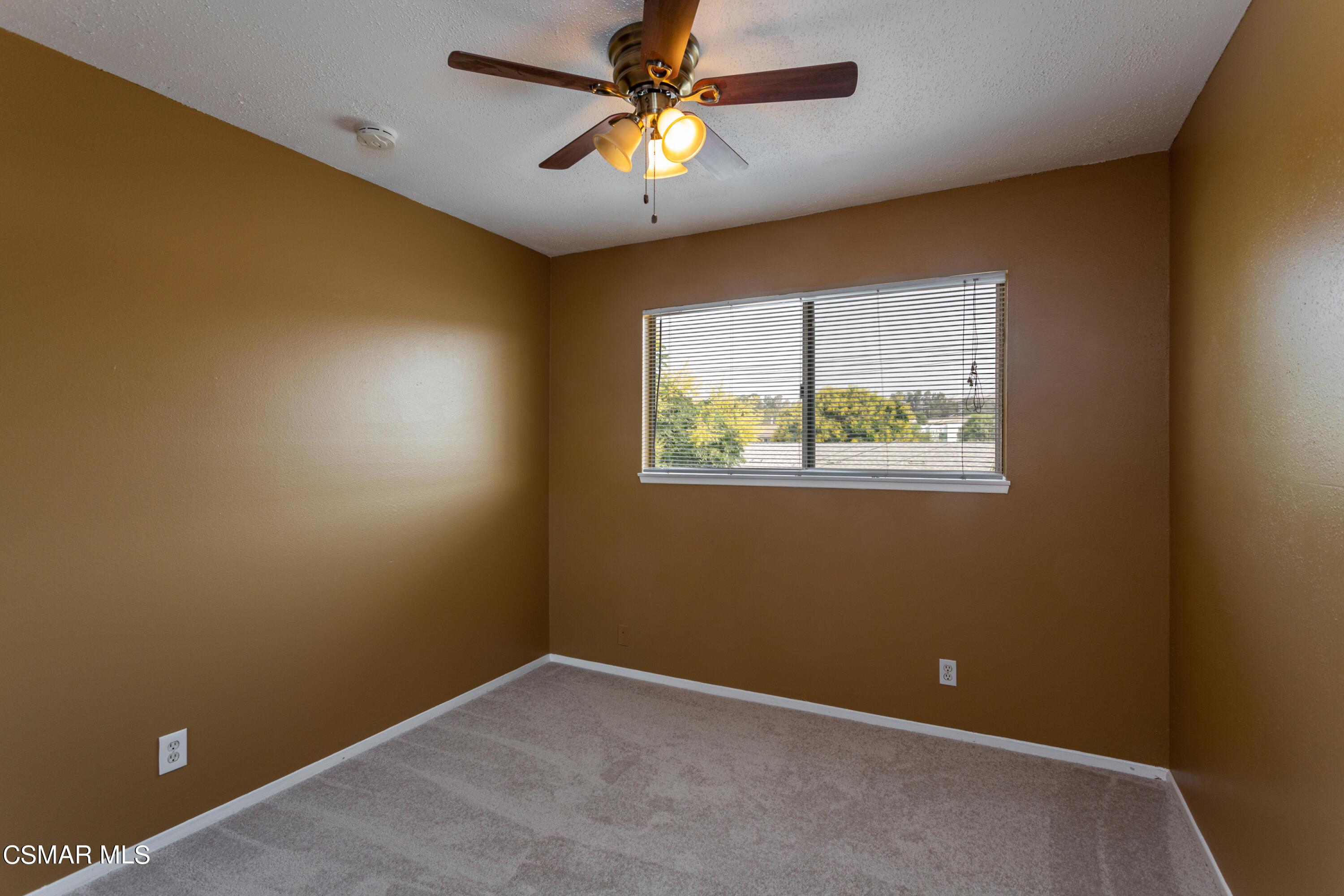 2291 Lysander Avenue Simi Valley, CA 93065 - Photo 16 of 25 an empty room with a window and a ceiling fan