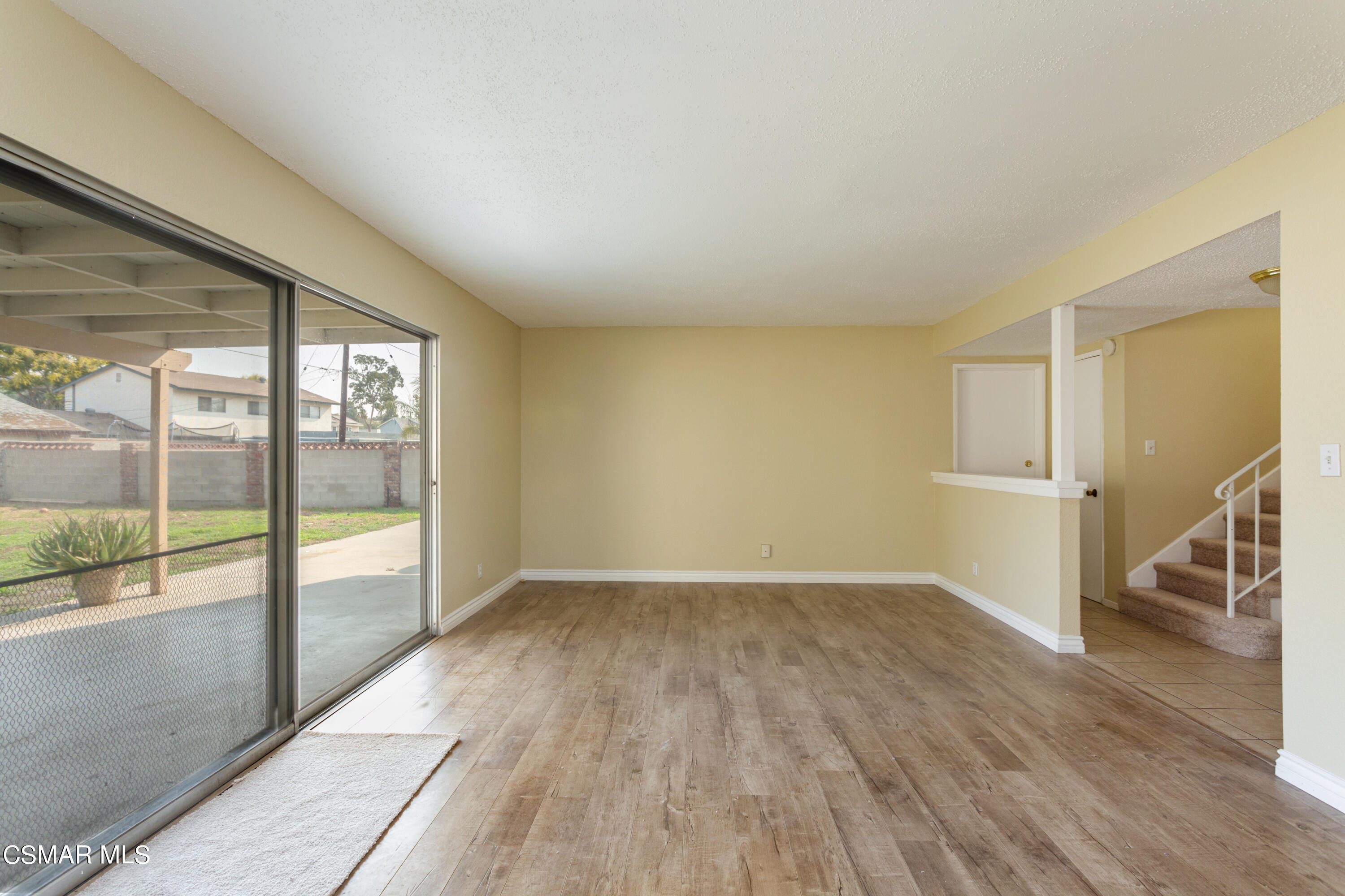 2291 Lysander Avenue Simi Valley, CA 93065 - Photo 5 of 25 an empty room with wooden floor and windows