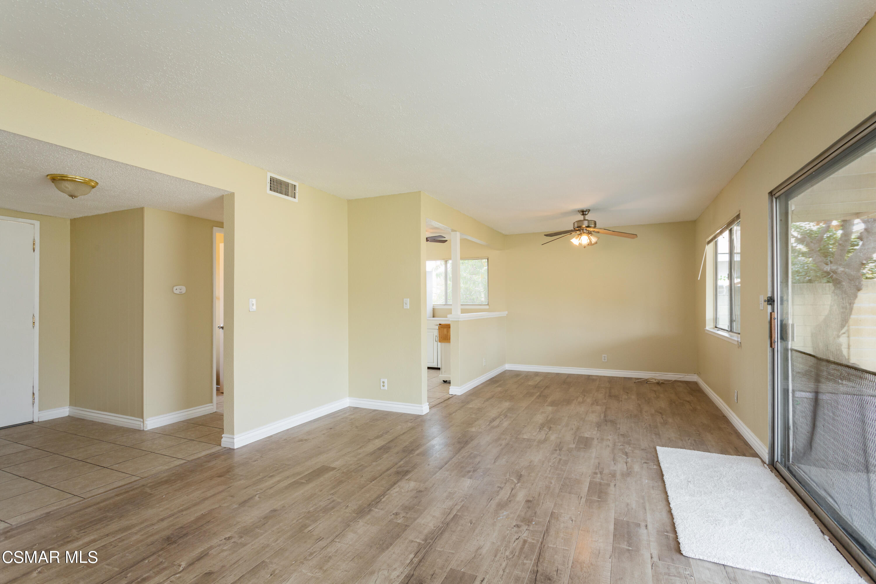 2291 Lysander Avenue Simi Valley, CA 93065 - Photo 6 of 25 an empty room with wooden floor and windows