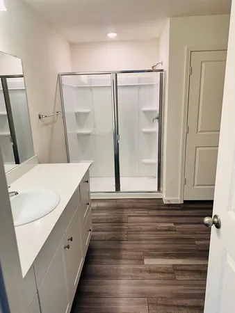 a bathroom with a sink and mirror