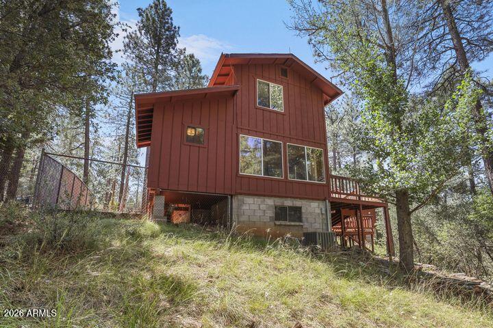 8884 Tonto Rim Drive Pine, AZ 85544 - Photo 6 of 43 a front view of a house with a yard