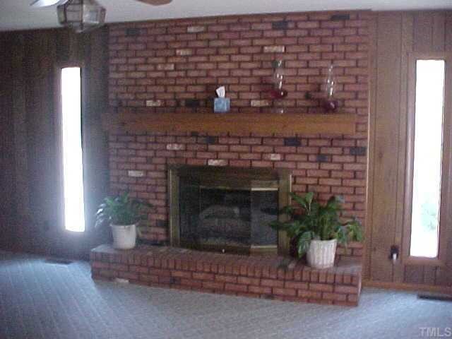 2209 Shenandoah Road Raleigh, NC 27603 - Photo 6 of 10 Beautiful masonry fireplace with gas logs in this nice family room!