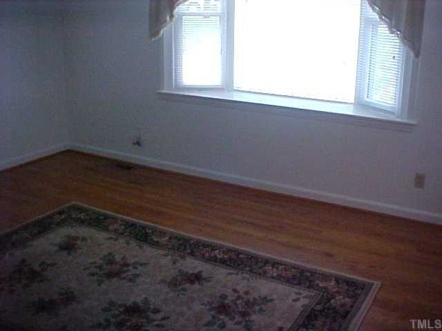 2209 Shenandoah Road Raleigh, NC 27603 - Photo 7 of 10 Gorgeous hardwood floors in living room!