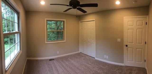 309 Butler Road Portland, TN 37148 - Photo 13 of 30 an empty room with windows and ceiling fan