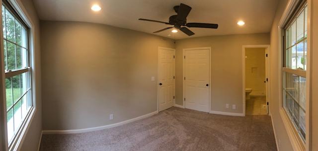 309 Butler Road Portland, TN 37148 - Photo 14 of 30 a view of a hallway with a ceiling fan and window