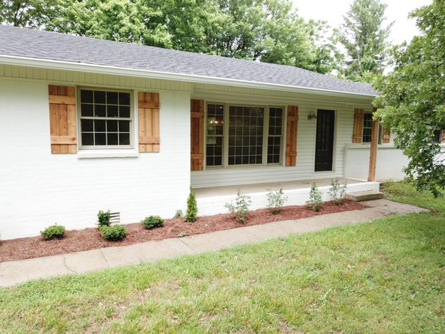 309 Butler Road Portland, TN 37148 - Photo 3 of 30 a front view of a house with a yard and a garage