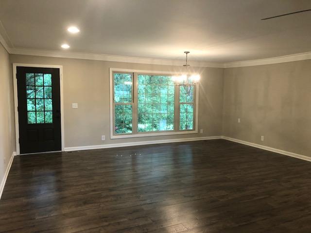 309 Butler Road Portland, TN 37148 - Photo 4 of 30 an empty room with wooden floor and windows