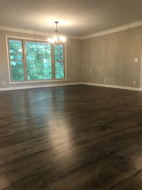 309 Butler Road Portland, TN 37148 - Photo 5 of 30 an empty room with wooden floor and windows
