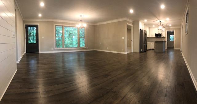 309 Butler Road Portland, TN 37148 - Photo 6 of 30 an empty room with wooden floor and windows
