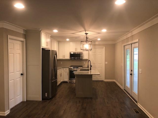 309 Butler Road Portland, TN 37148 - Photo 7 of 30 a view of kitchen with stainless steel appliances refrigerator stove microwave and cabinets