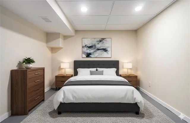 a bedroom with a bed and a potted plant