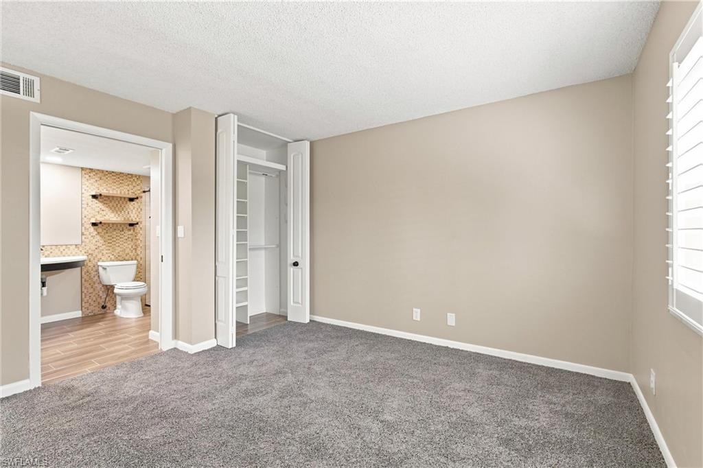 1000 Manatee Road, Unit A102 Naples, FL 34114 - Photo 10 of 28 Primary Bedroom