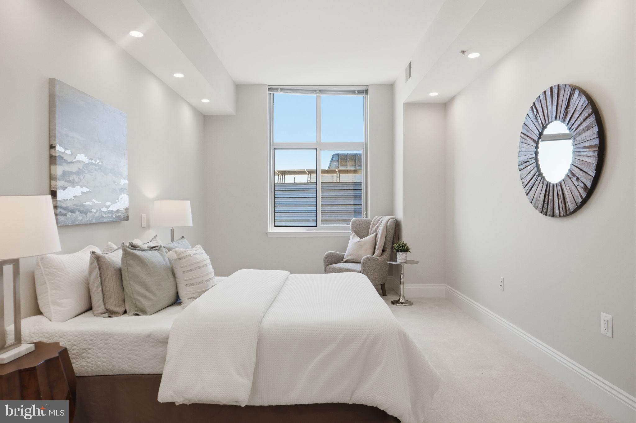 11990 Market Street, Unit 2103 Reston, VA 20190 - Photo 44 of 78 Serene bedroom with natural light.