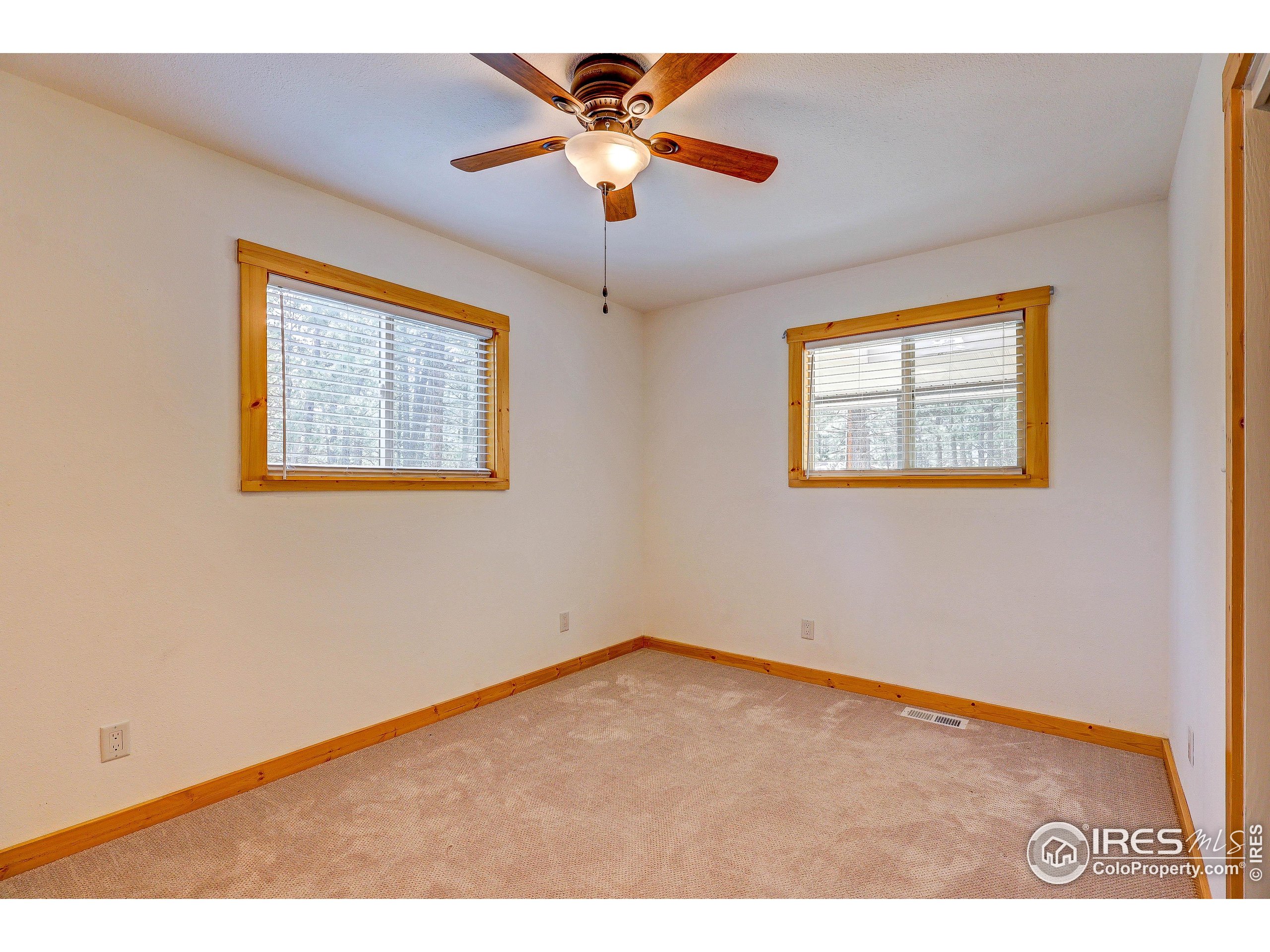 166 Cherokee Road Lyons, CO 80540 - Photo 32 of 38 a view of an empty room with a window
