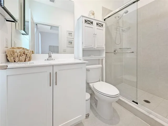 a view of a hallway with stairs