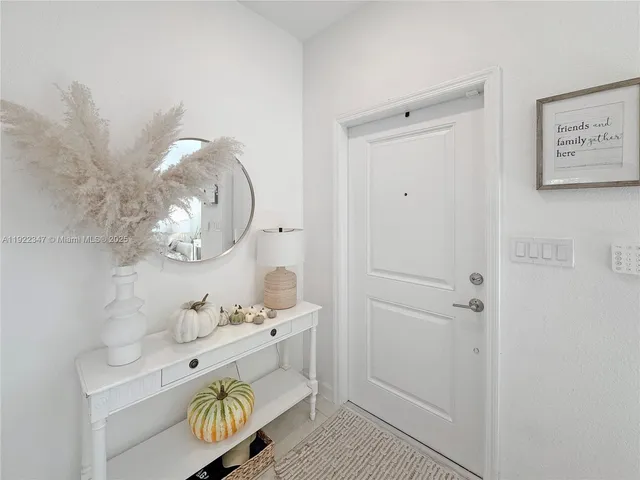 a bathroom with a sink mirror and vanity