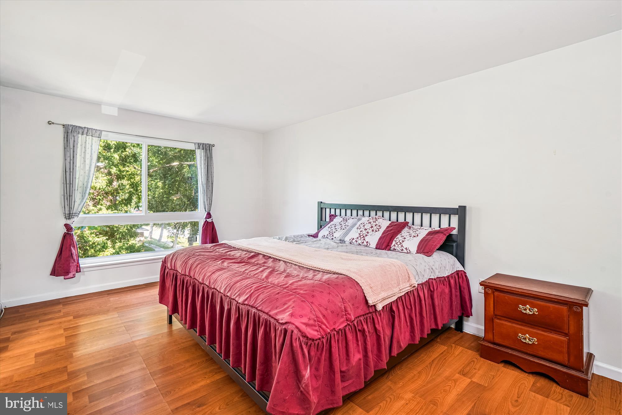 3946 Bel Pre Road, Unit 4 Silver Spring, MD 20906 - Photo 12 of 30 a bedroom with a bed and a window