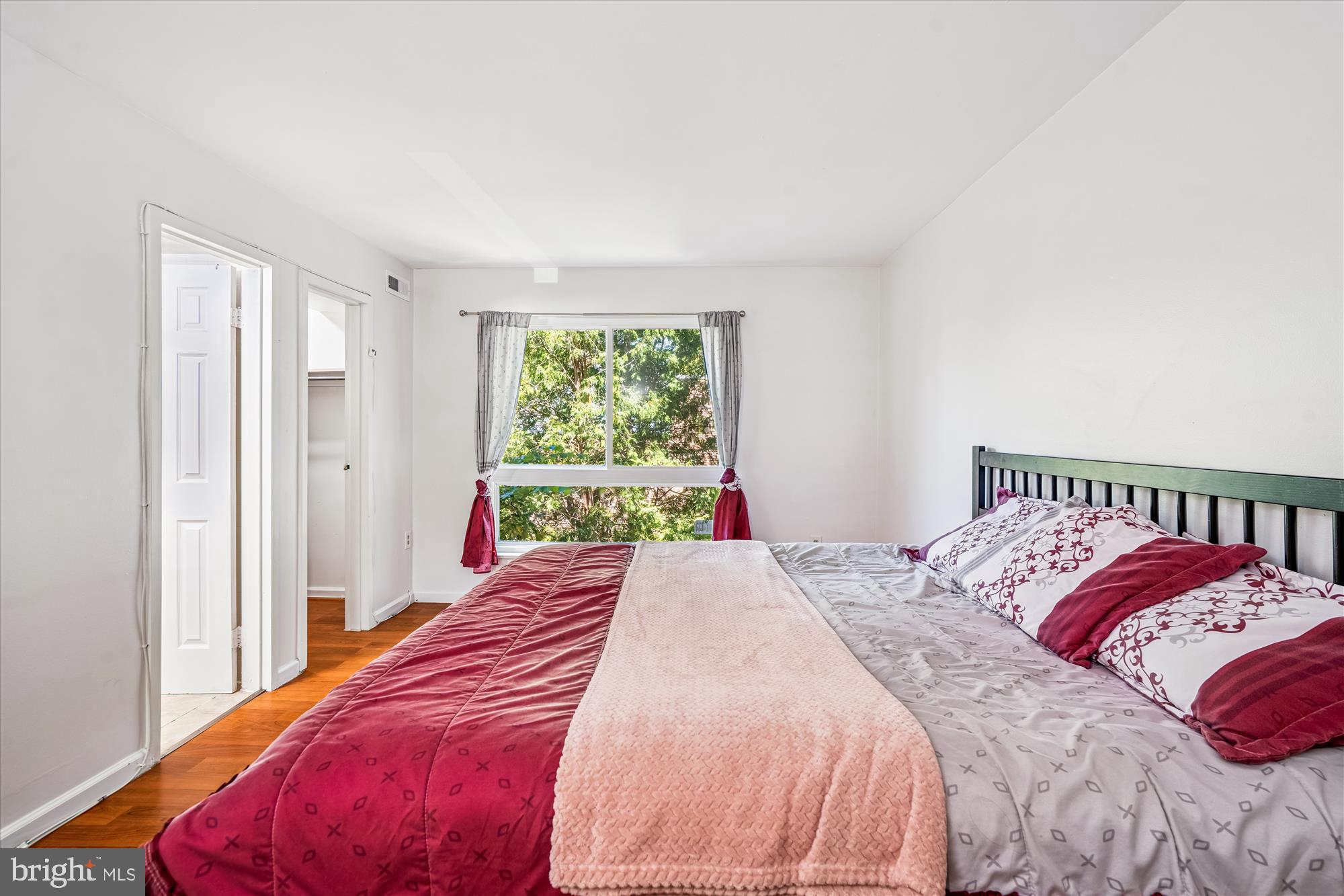 3946 Bel Pre Road, Unit 4 Silver Spring, MD 20906 - Photo 13 of 30 a bedroom with a bed and a window