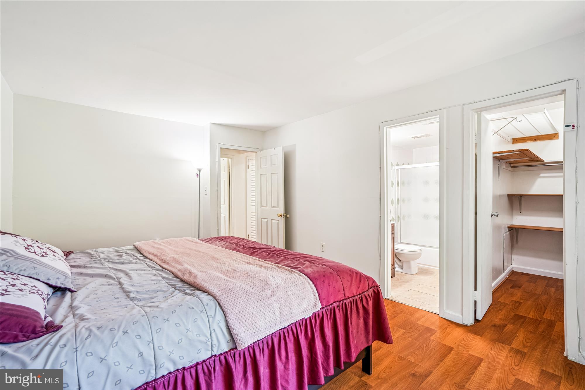 3946 Bel Pre Road, Unit 4 Silver Spring, MD 20906 - Photo 14 of 30 a bedroom with a bed and a view of bathroom