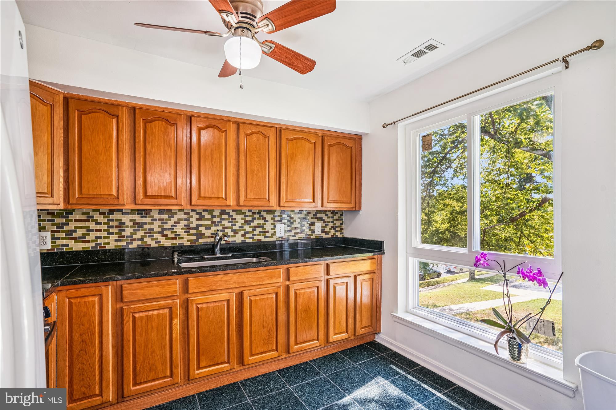 3946 Bel Pre Road, Unit 4 Silver Spring, MD 20906 - Photo 4 of 30 a view of a bedroom with wooden floor and windows
