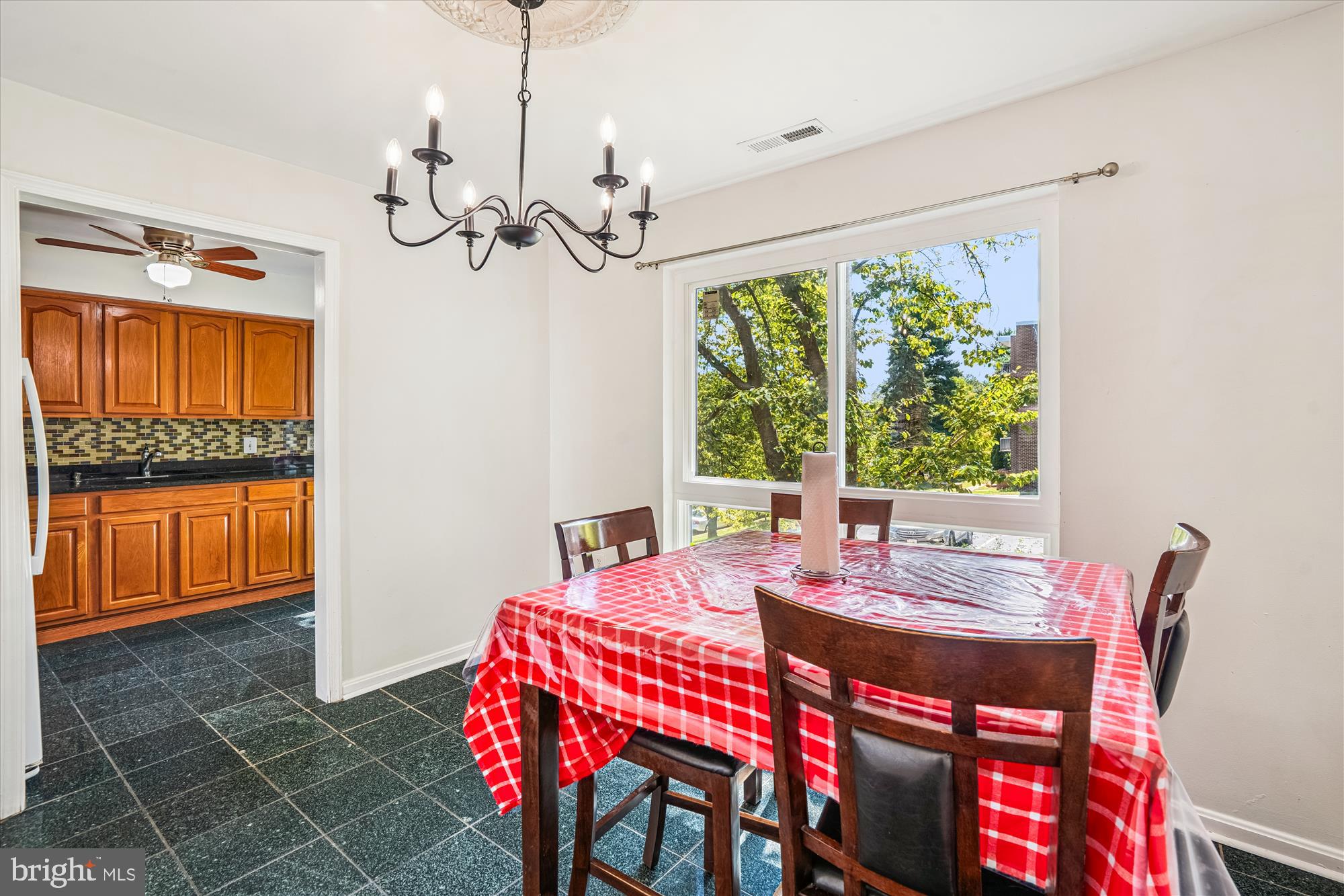 3946 Bel Pre Road, Unit 4 Silver Spring, MD 20906 - Photo 6 of 30 a view of a dining room with furniture window and outside view