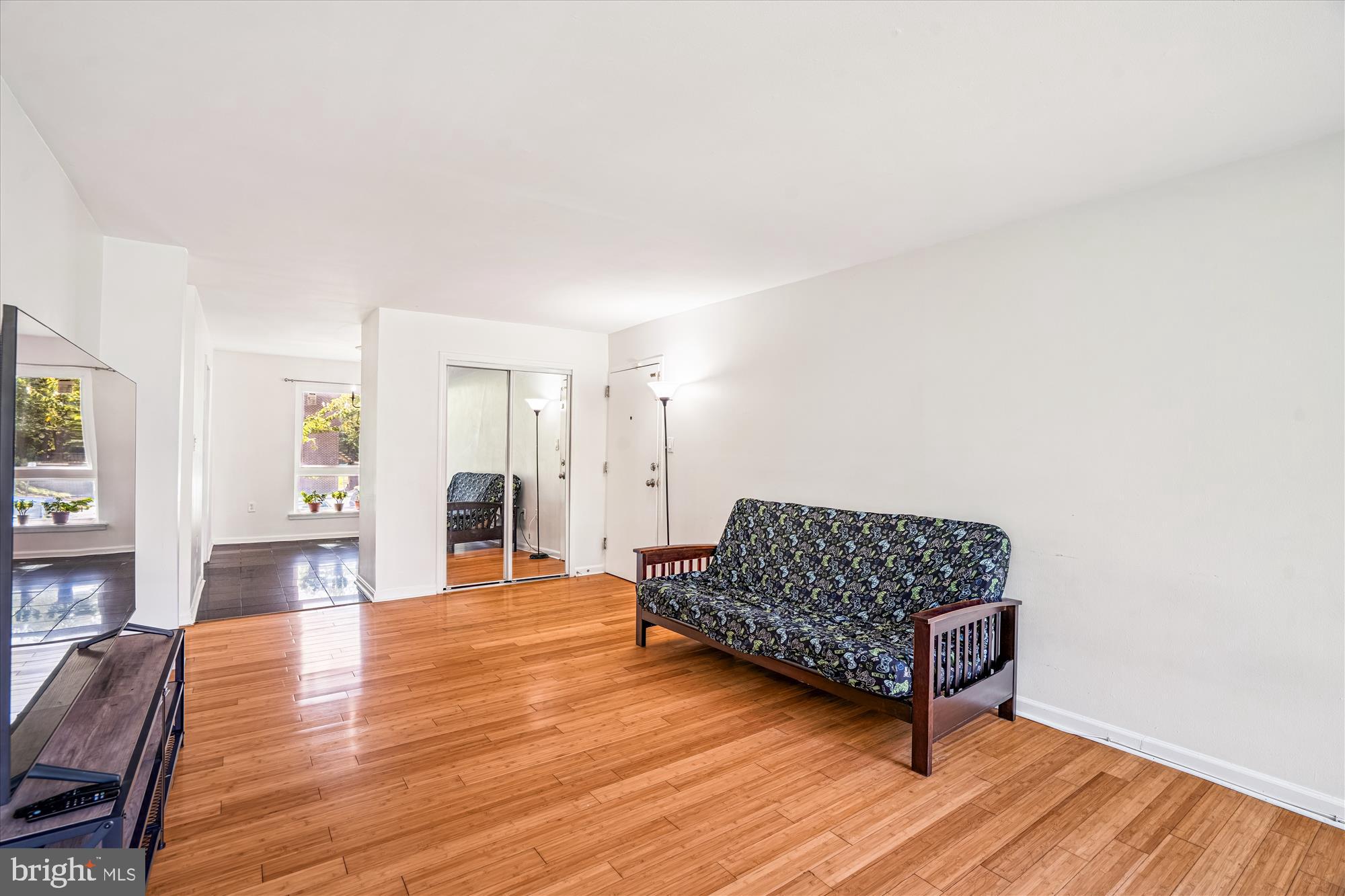 3946 Bel Pre Road, Unit 4 Silver Spring, MD 20906 - Photo 9 of 30 a living room with furniture and a wooden floor