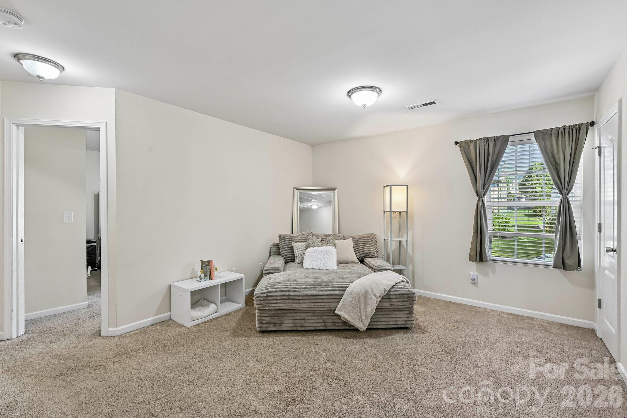 2206 Turtle Point Road Charlotte, NC 28262 - Photo 19 of 28 a bedroom with bed and a large window