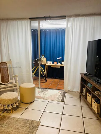 a living room with a couch and a flat screen tv