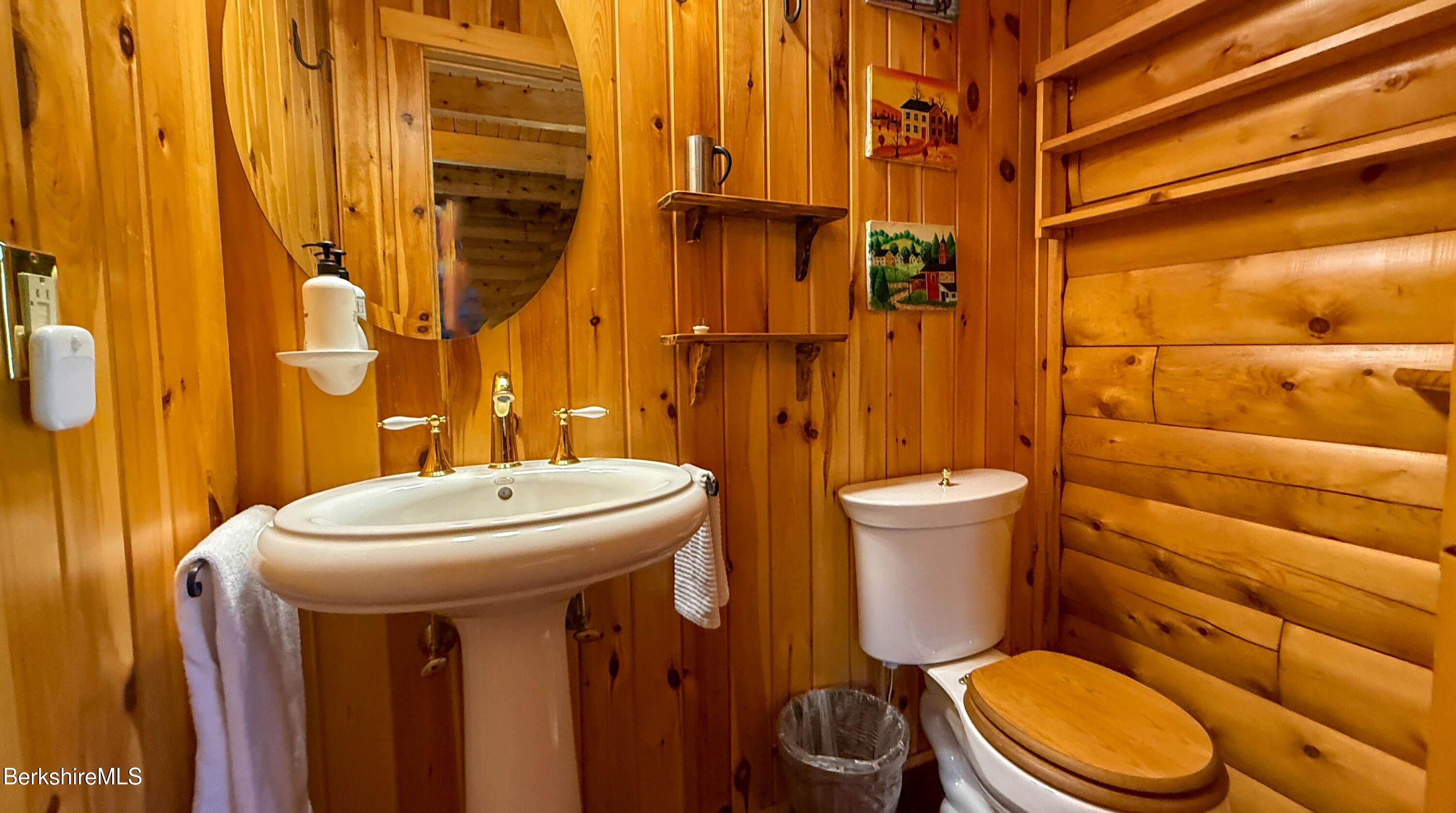233 Algerie Road Becket, MA 01223 - Photo 21 of 48 a bathroom with a sink a toilet and shower curtain