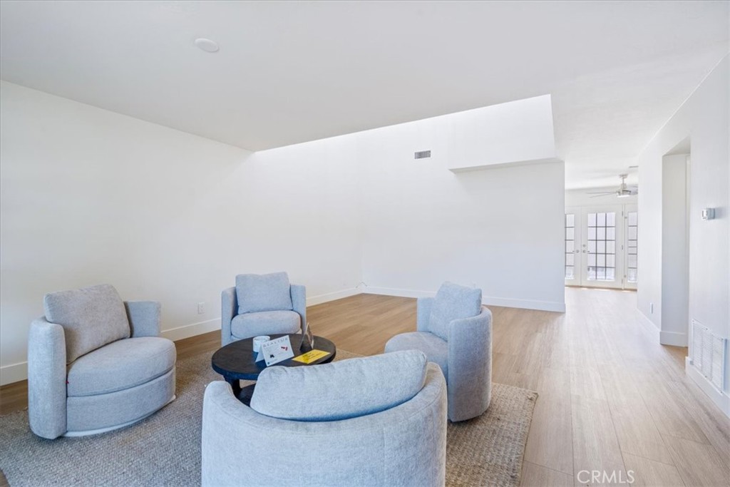 4 Wintergreen, Unit 4 Irvine, CA 92604 - Photo 17 of 39 a living room with furniture and wooden floor