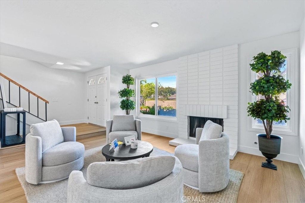 4 Wintergreen, Unit 4 Irvine, CA 92604 - Photo 18 of 39 a living room with furniture potted plant and a window