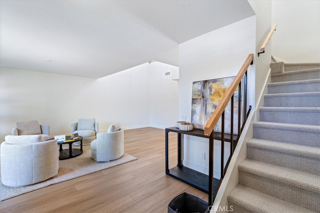 4 Wintergreen, Unit 4 Irvine, CA 92604 - Photo 19 of 39 a view of entryway and hall with wooden floor
