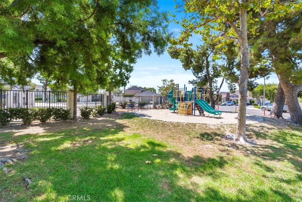 4 Wintergreen, Unit 4 Irvine, CA 92604 - Photo 36 of 39 a view of yard with swimming pool and trees
