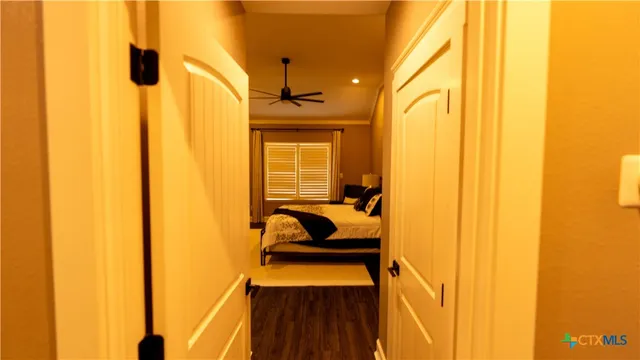 a bedroom with furniture and a window