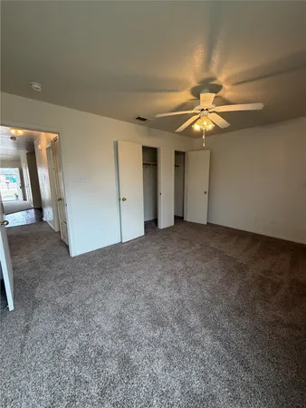 a view of a livingroom with a ceiling fan
