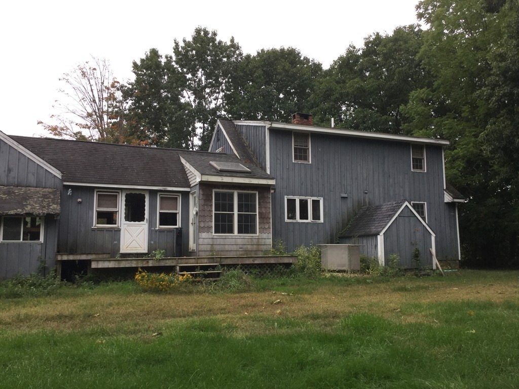 57 Cunningham Road Boxborough, MA 01719 - Photo 3 of 29 a front view of a house with garden