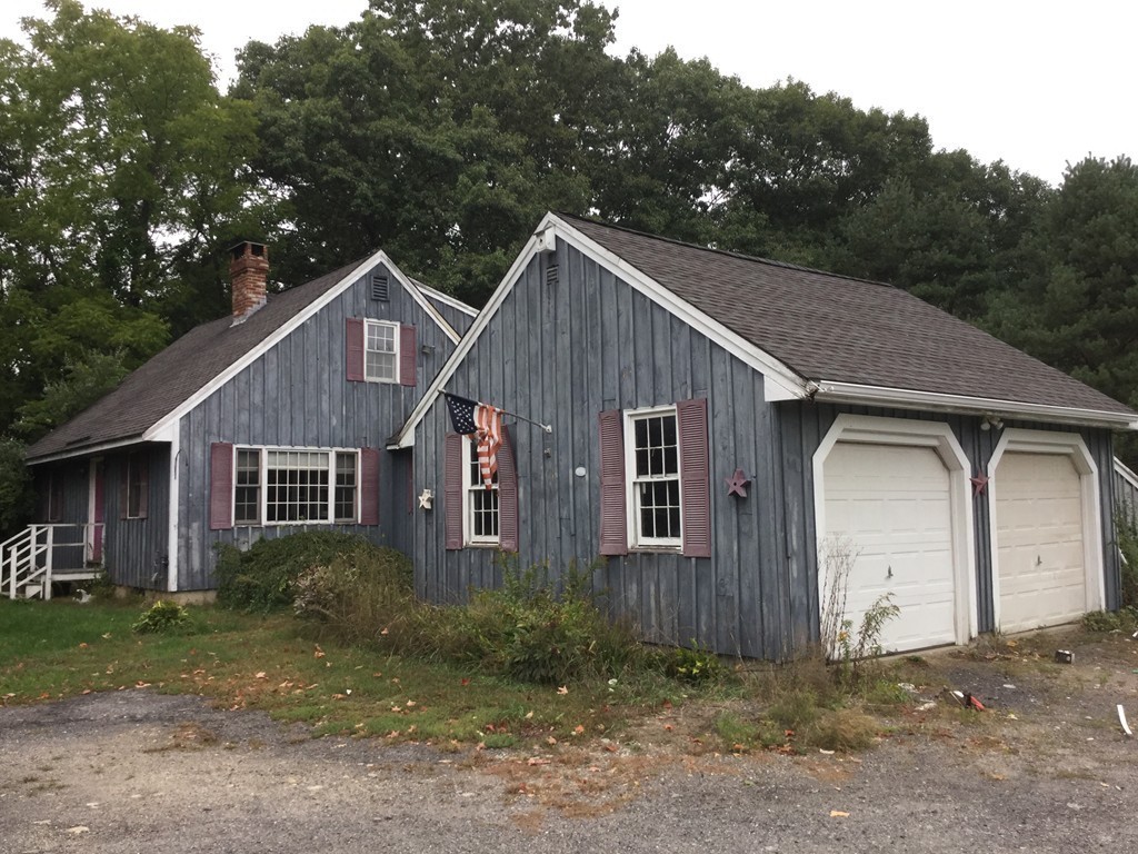 57 Cunningham Road Boxborough, MA 01719 - Photo 4 of 29 a house view with a garden space