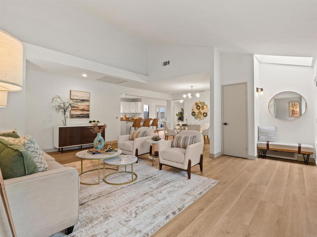 13737 Temple Street Poway, CA 92064 - Photo 6 of 38 a living room with furniture and a flat screen tv