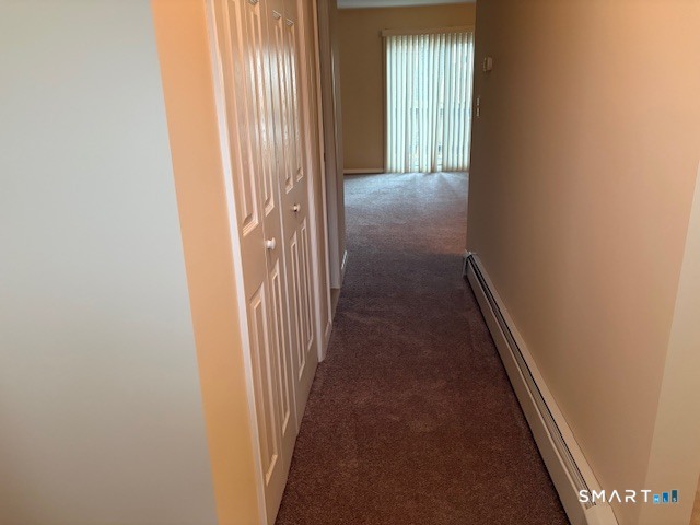 31 Sutton Place, Unit 31 Bloomfield, CT 06002 - Photo 13 of 28 a view of a livingroom from a hallway